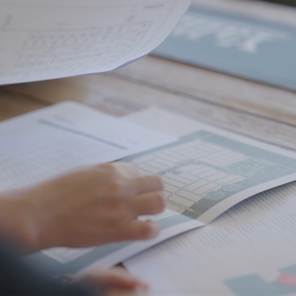 Prospecting home buyer reviewing Yallarah master plan for house location